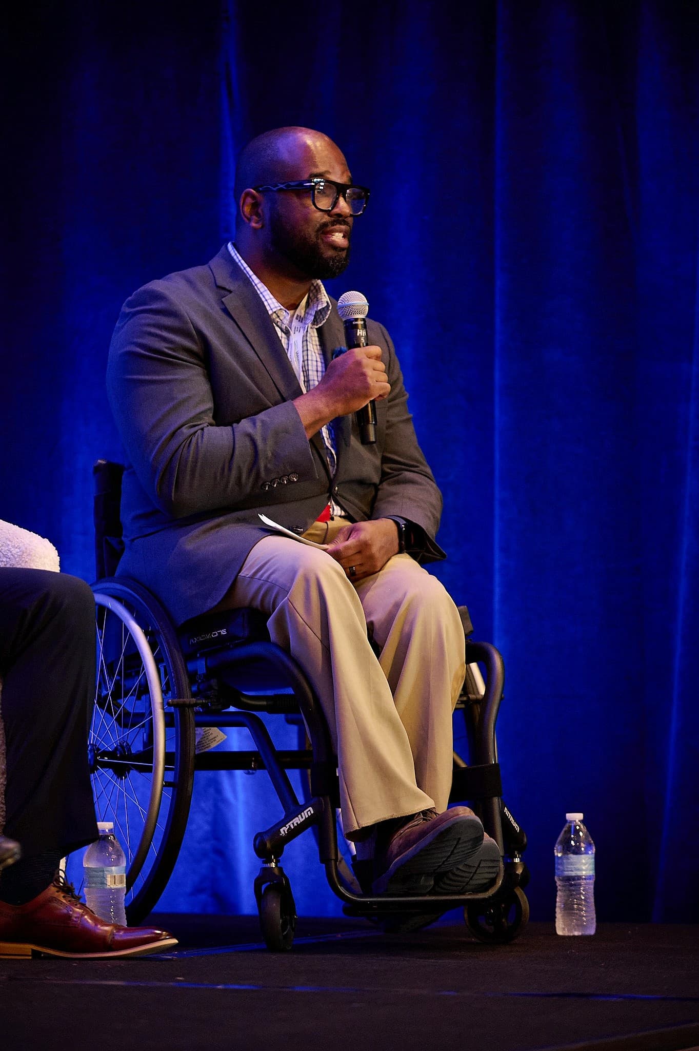 Speaker addressing a conference session — professional conference photography