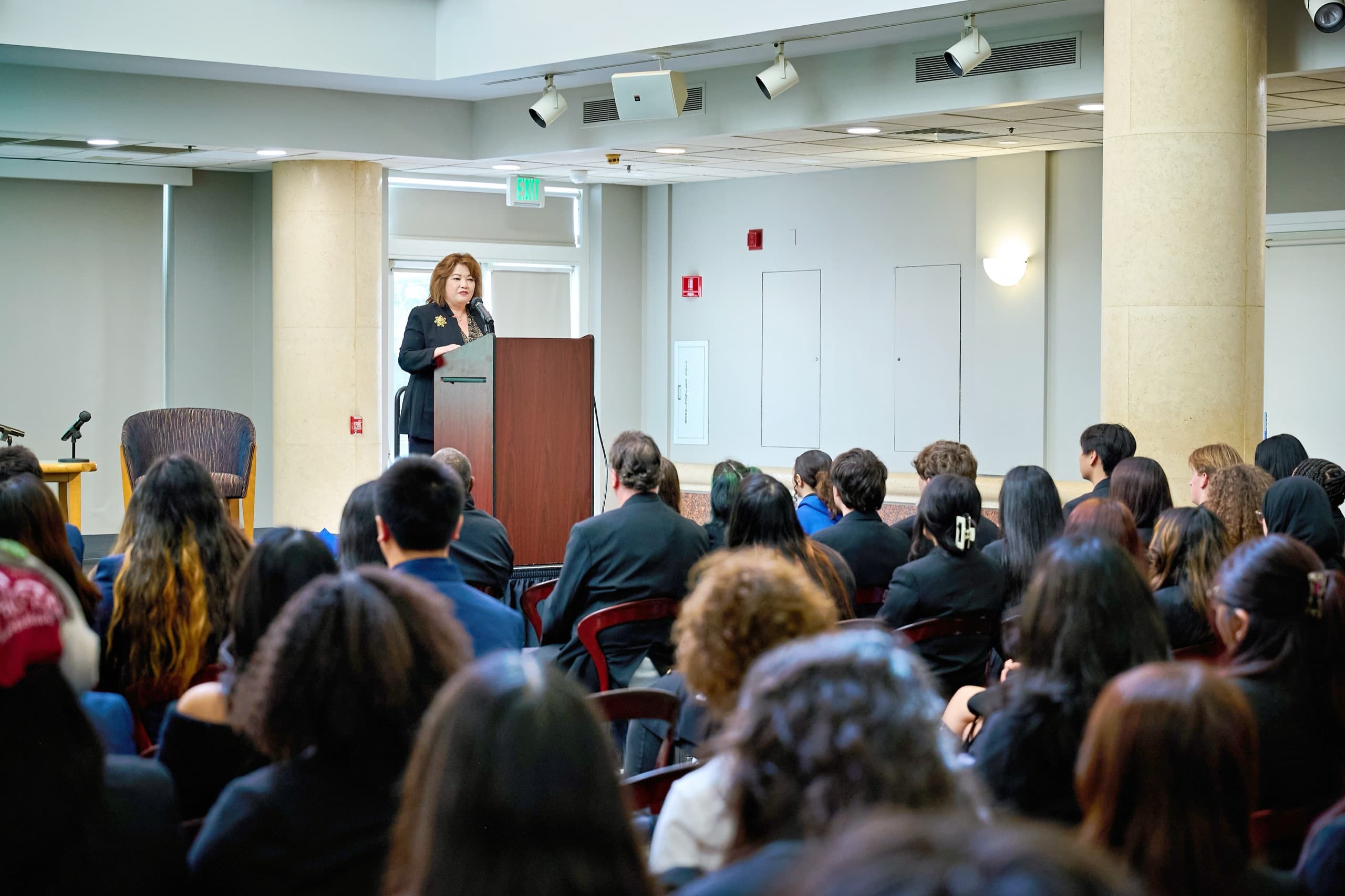 Speaker at the podium during a Sacramento legal conference — conference photographer