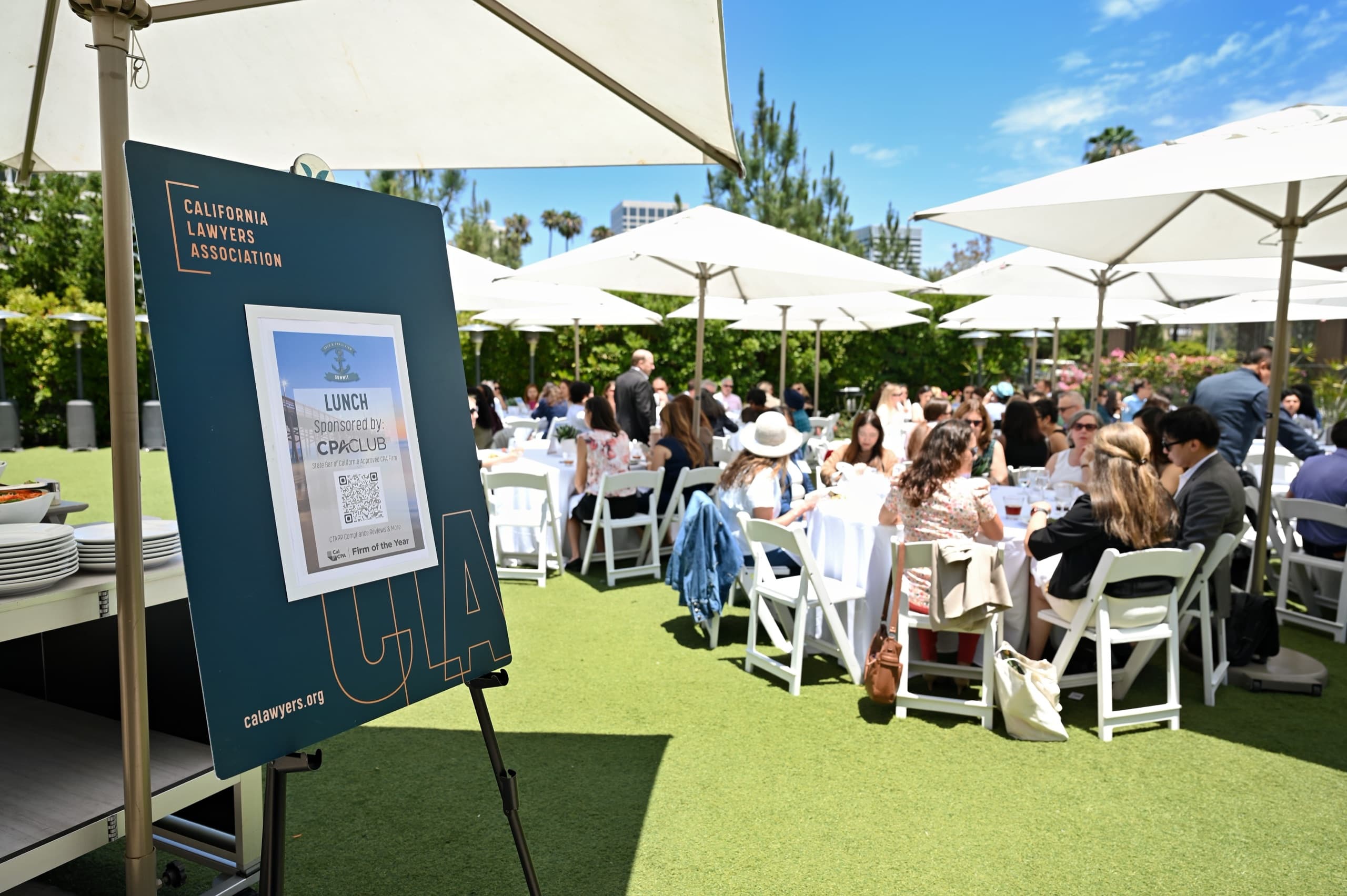 Attendees at an outdoor conference lunch — professional conference photography California