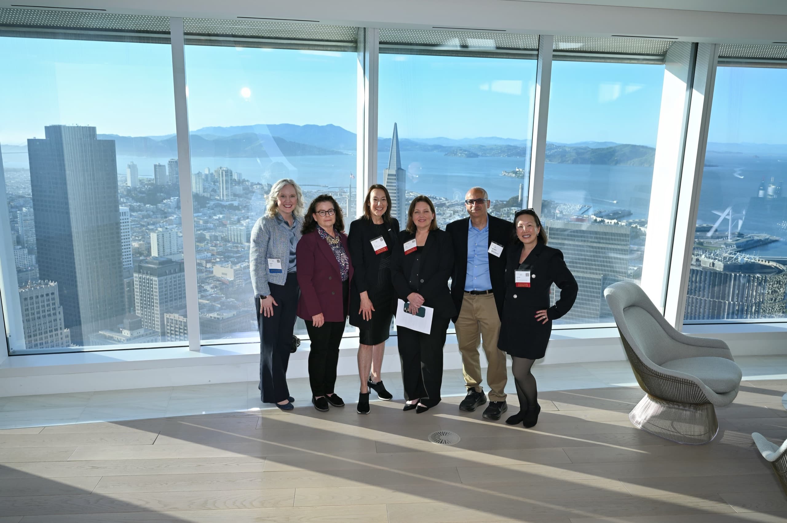 Corporate networking reception with San Francisco skyline views — event photography
